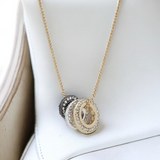 DKNY Tri-Tone Pavé Circle Pendant Necklace